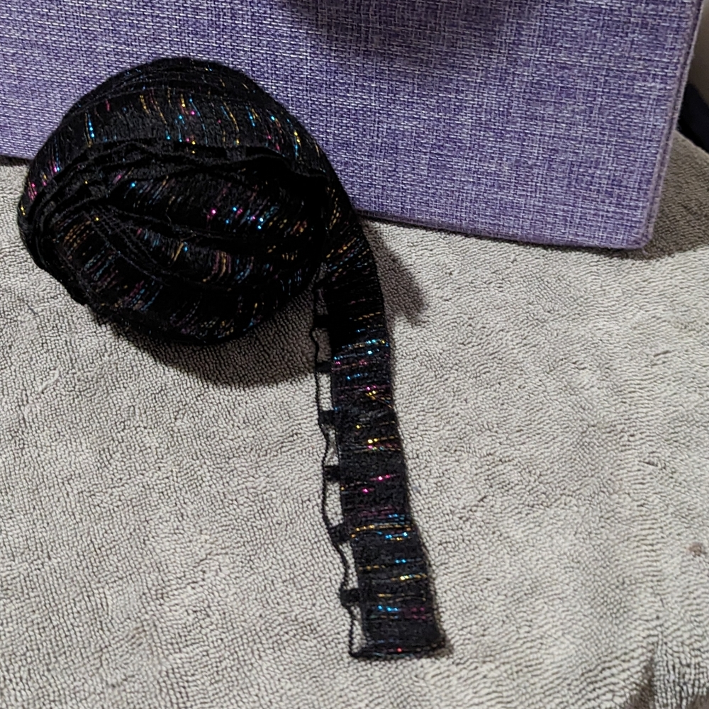 YARN Novelty Ribbon-like, black with gold, blue, magenta tinsel PARTIAL SKEIN